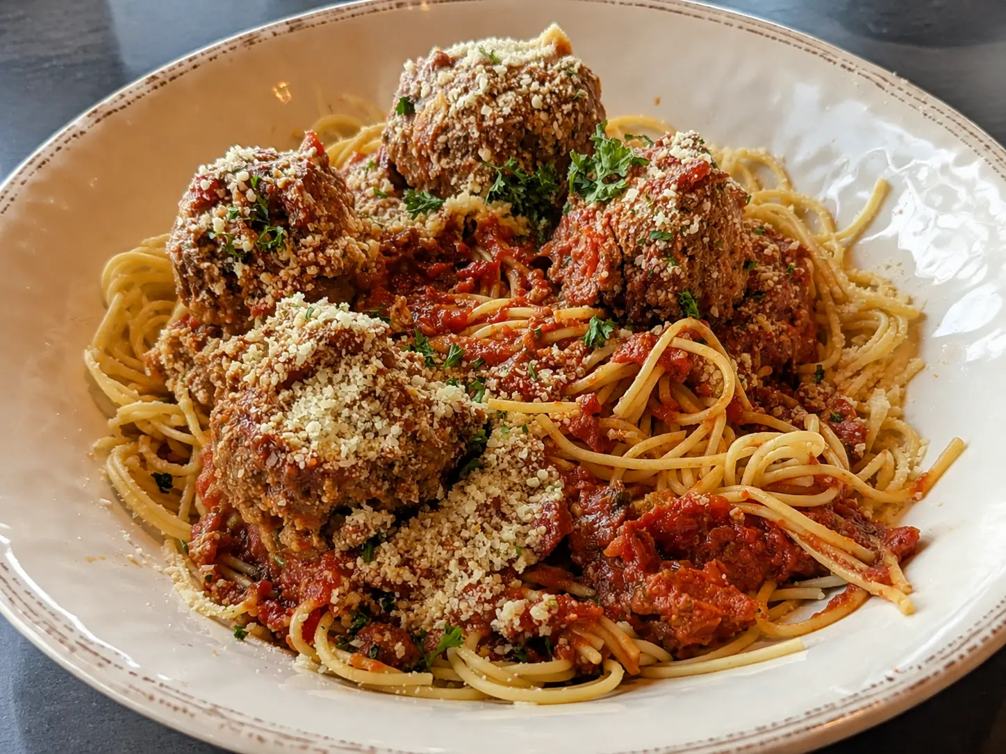 Family-style spaghetti and homemade meatballs at Papa Geno’s Skyroom