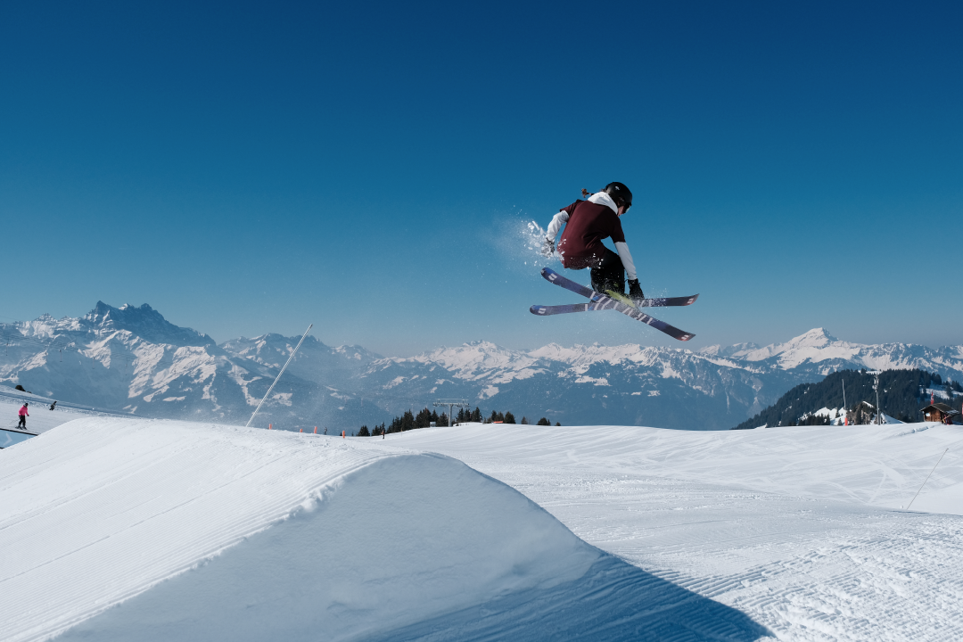 CTA Snowpark Freestyle Skier Pulling Grab Figure in Villars