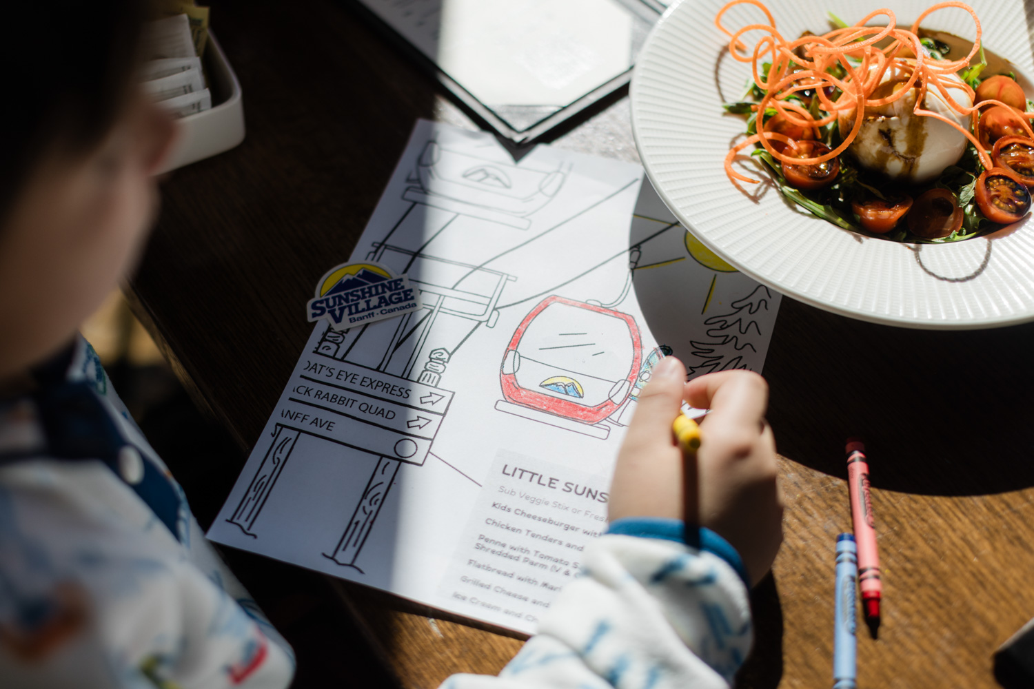 Kid colouring and eating at Chimney Corner | Royce Sihlis